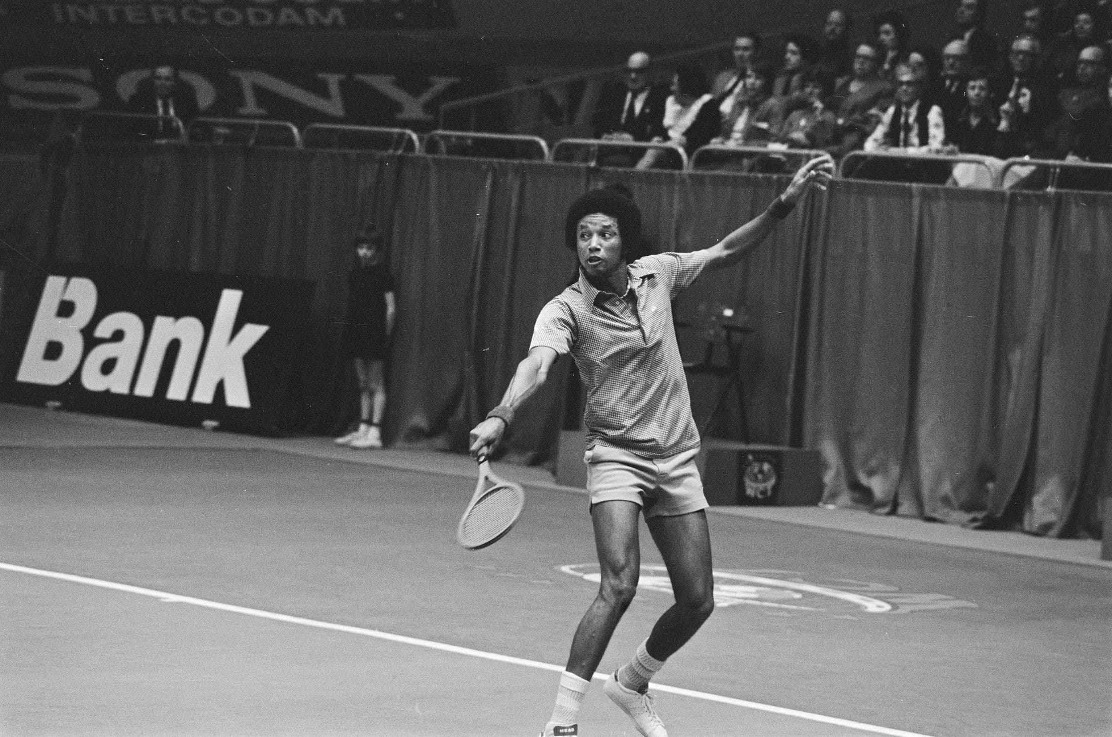 Arthur Ashe playing tennis in the mid-1970s