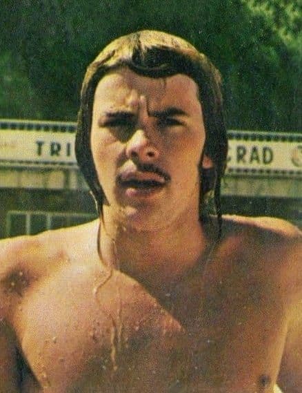A young swimmer at a 1970s international swimming event