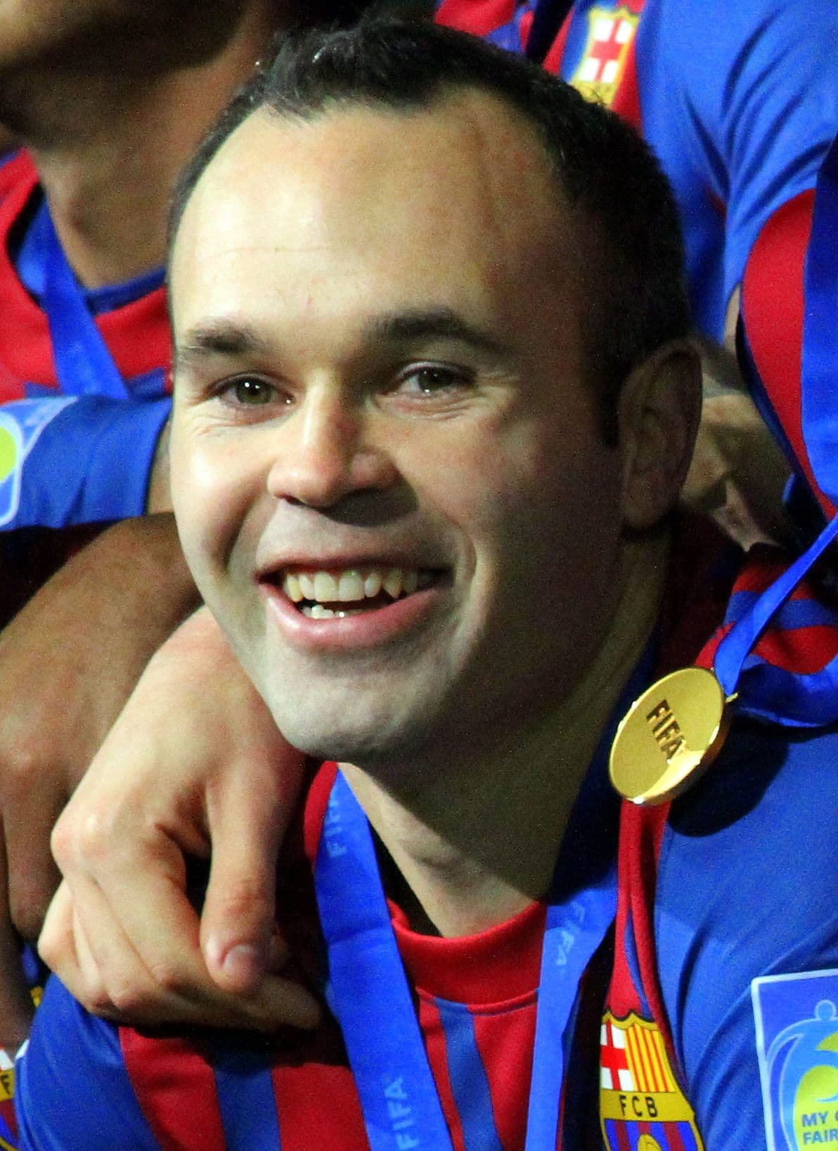 Andrés Iniesta celebrating with a gold medal after a major tournament win