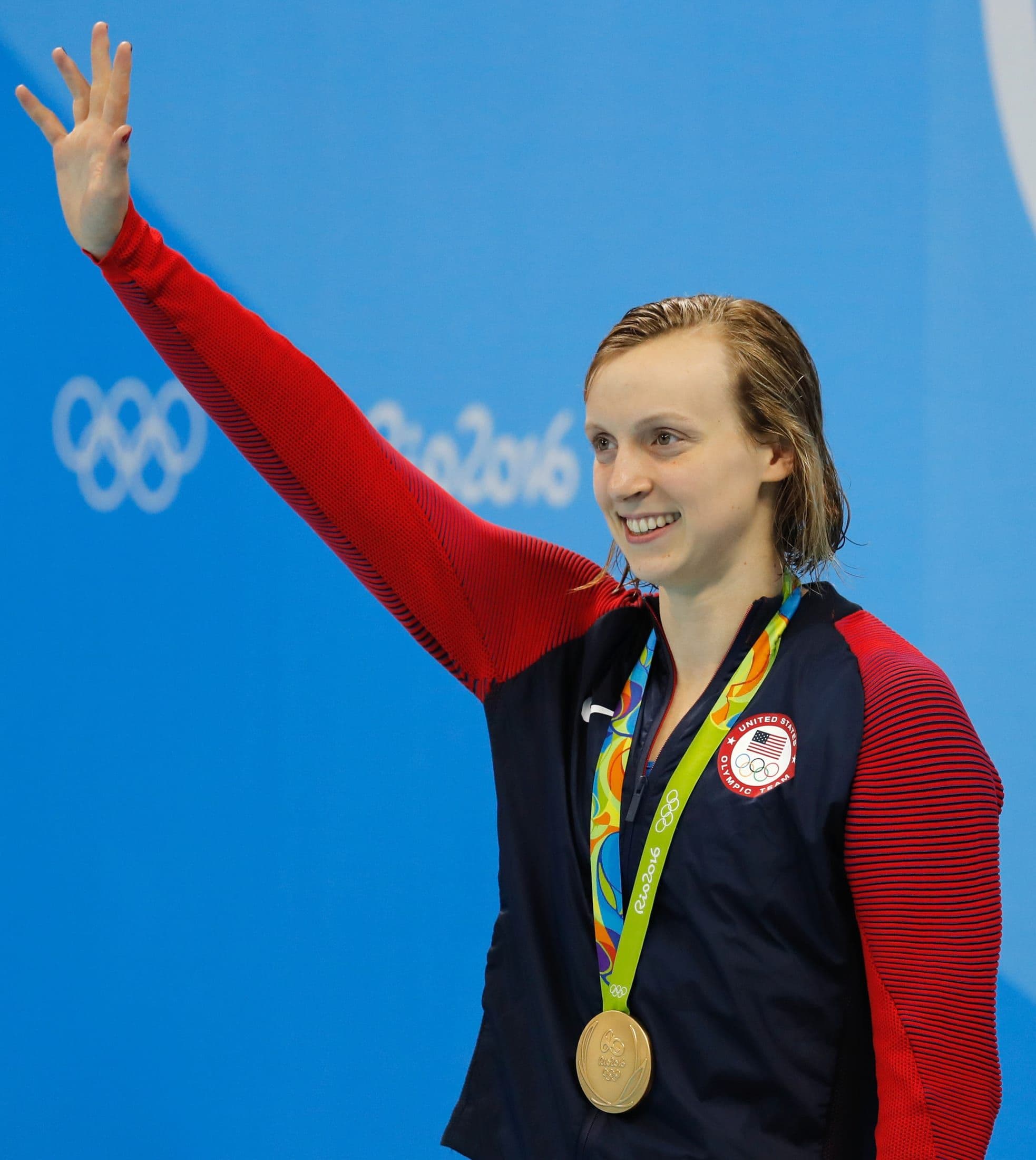 Katie Ledecky celebrating with a gold medal at the 2016 Rio Olympics